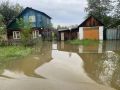 В селе Ермаковское из-за сильных дождей поднялась вода в реке Оя